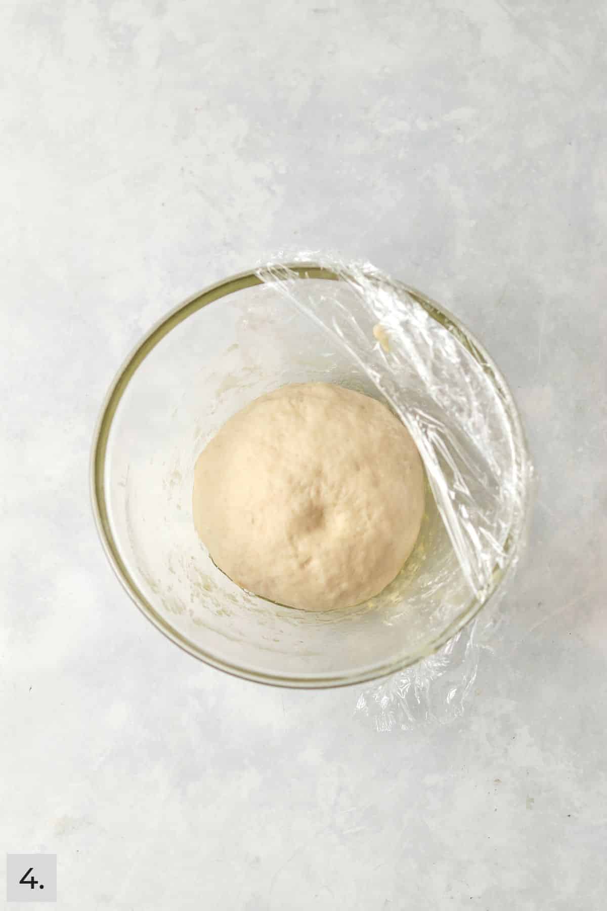 Small batch of dough in a bowl after proofing.