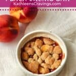 Single serve peach crumb bar in a ramekin.