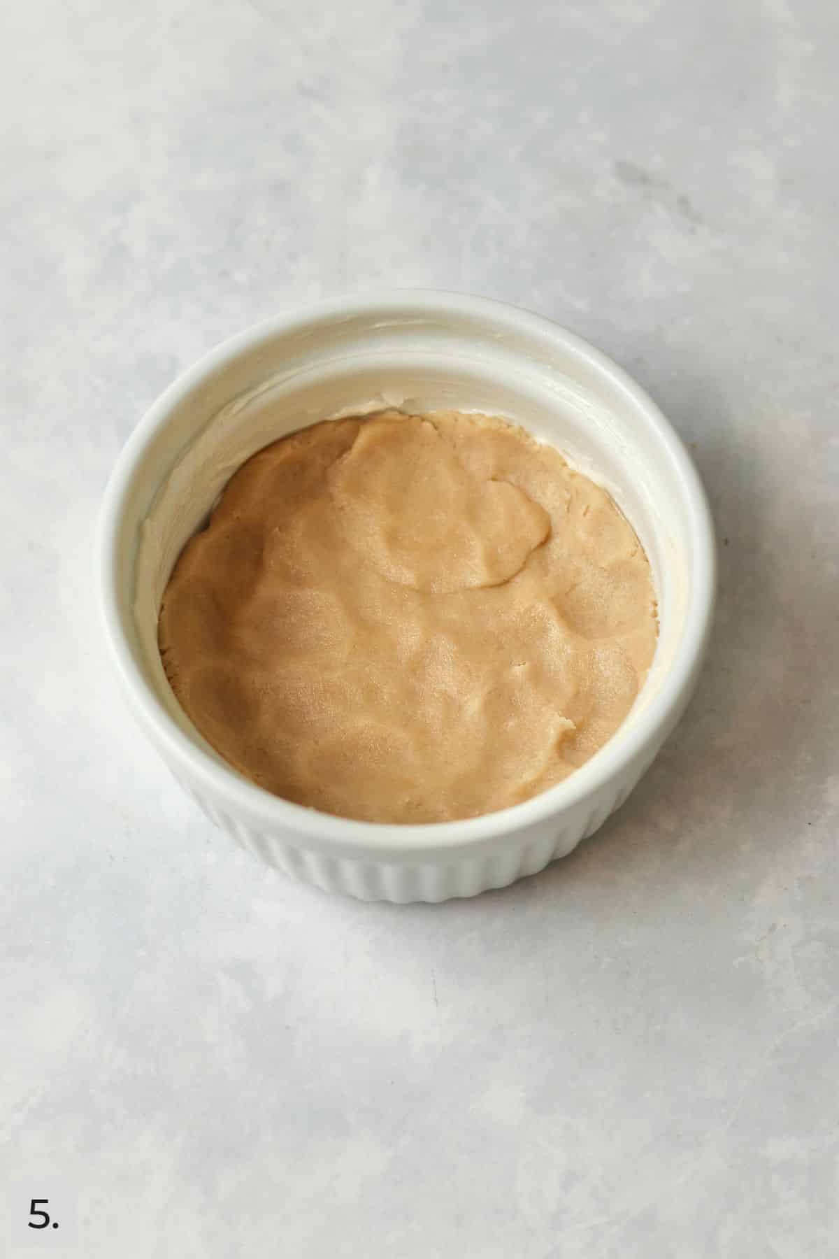 Crumb dough pressed into large ramekin.