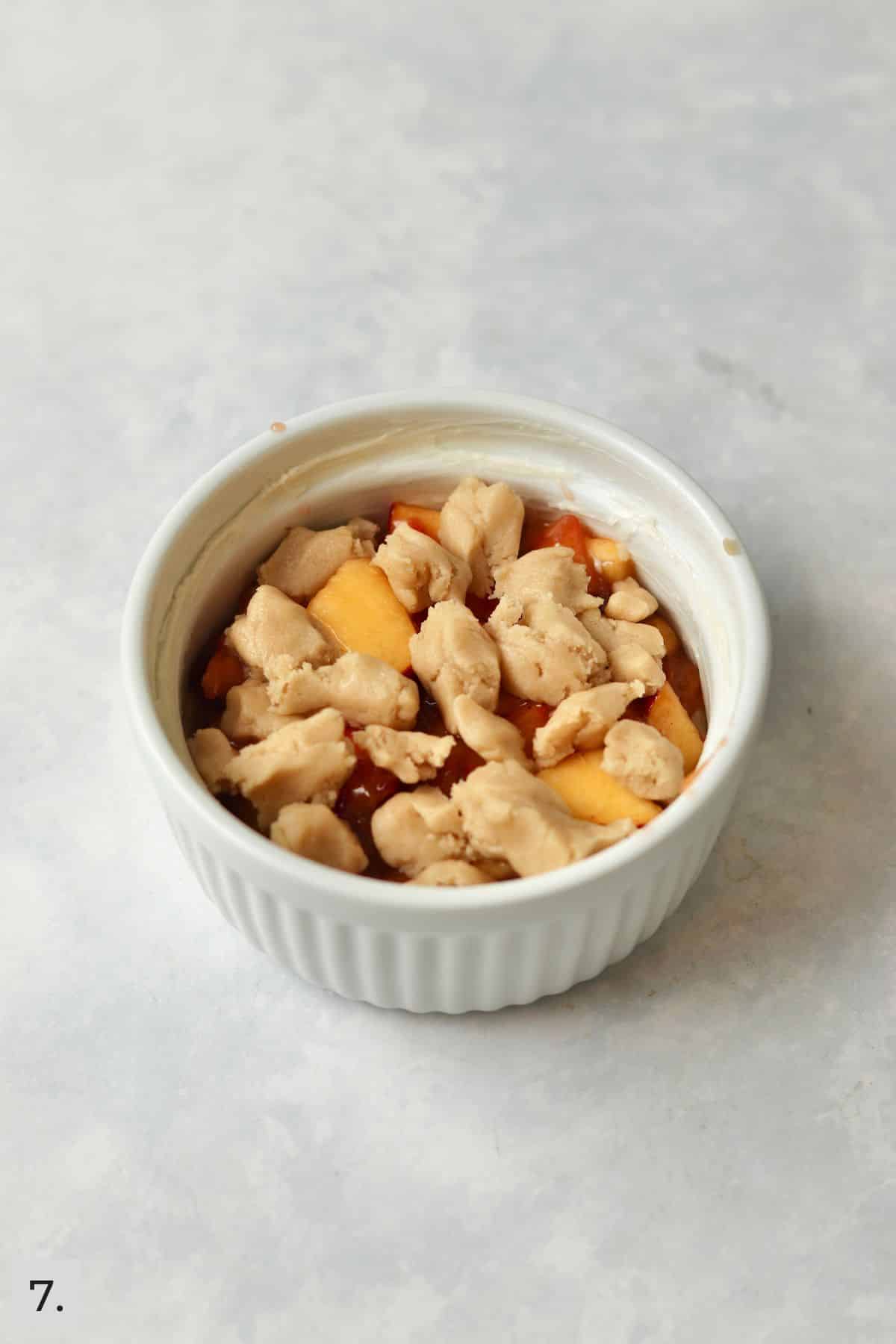 Single serve peach crumb bar before baking.