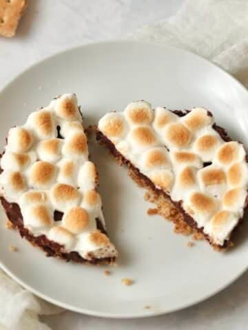 Single serve s'mores bar with mini marshmallows on a small plate.