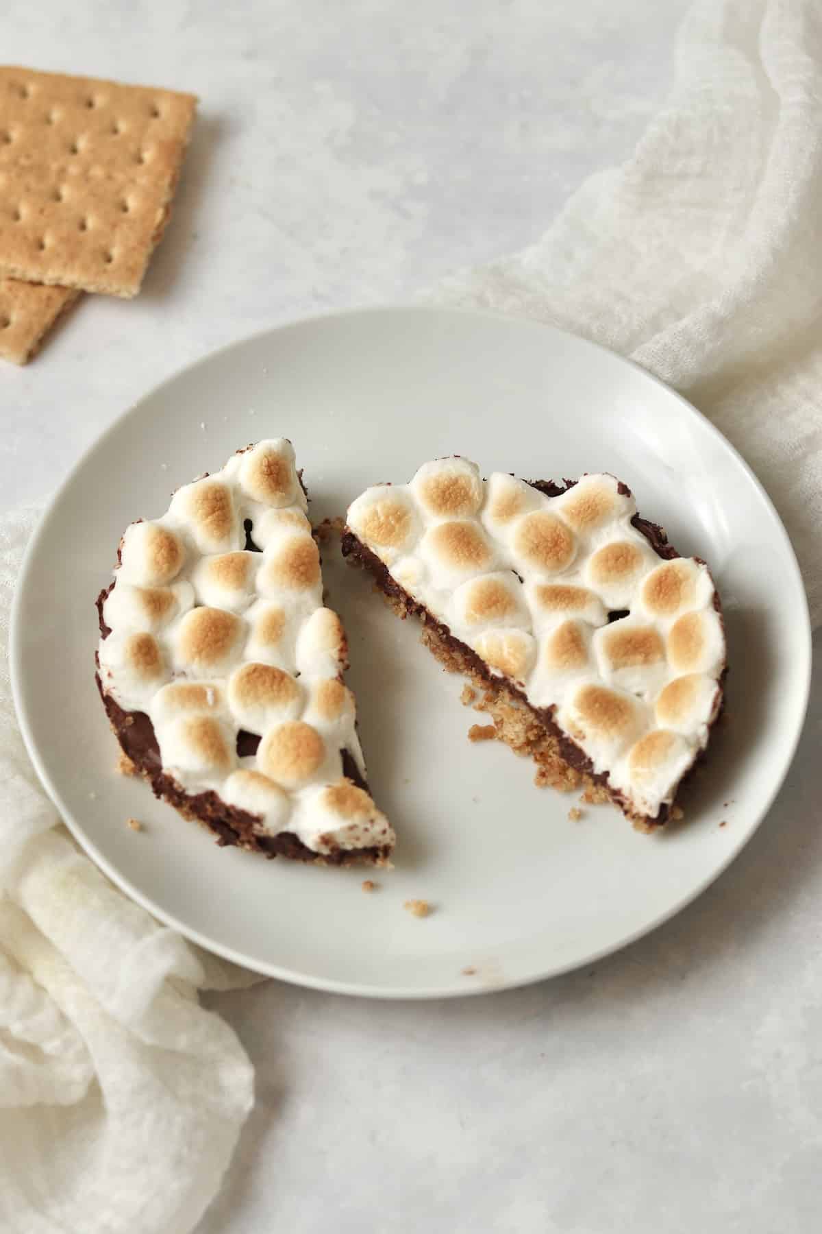 Single serve s'mores bar with mini marshmallows on a small plate.