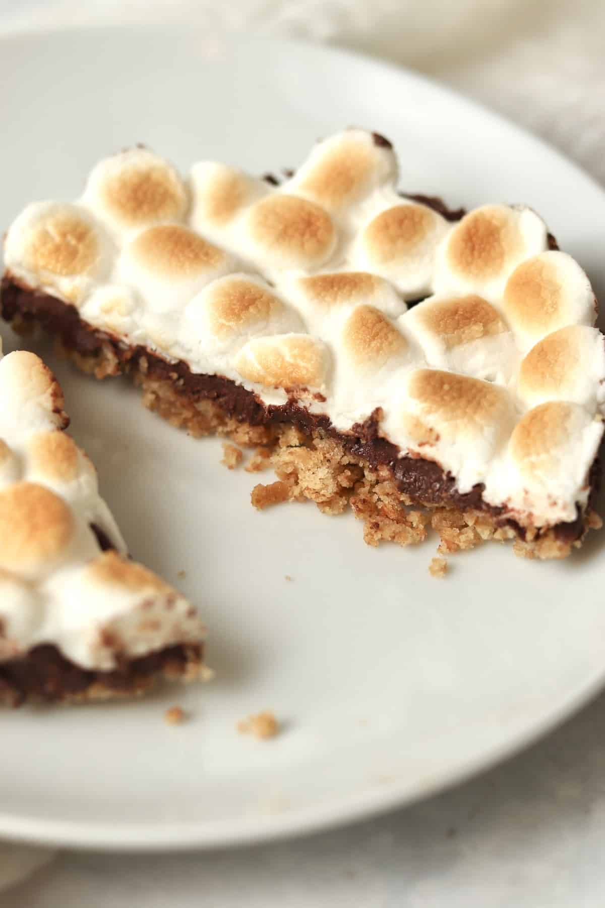 Single serve s'mores bar cut in half on a plate.