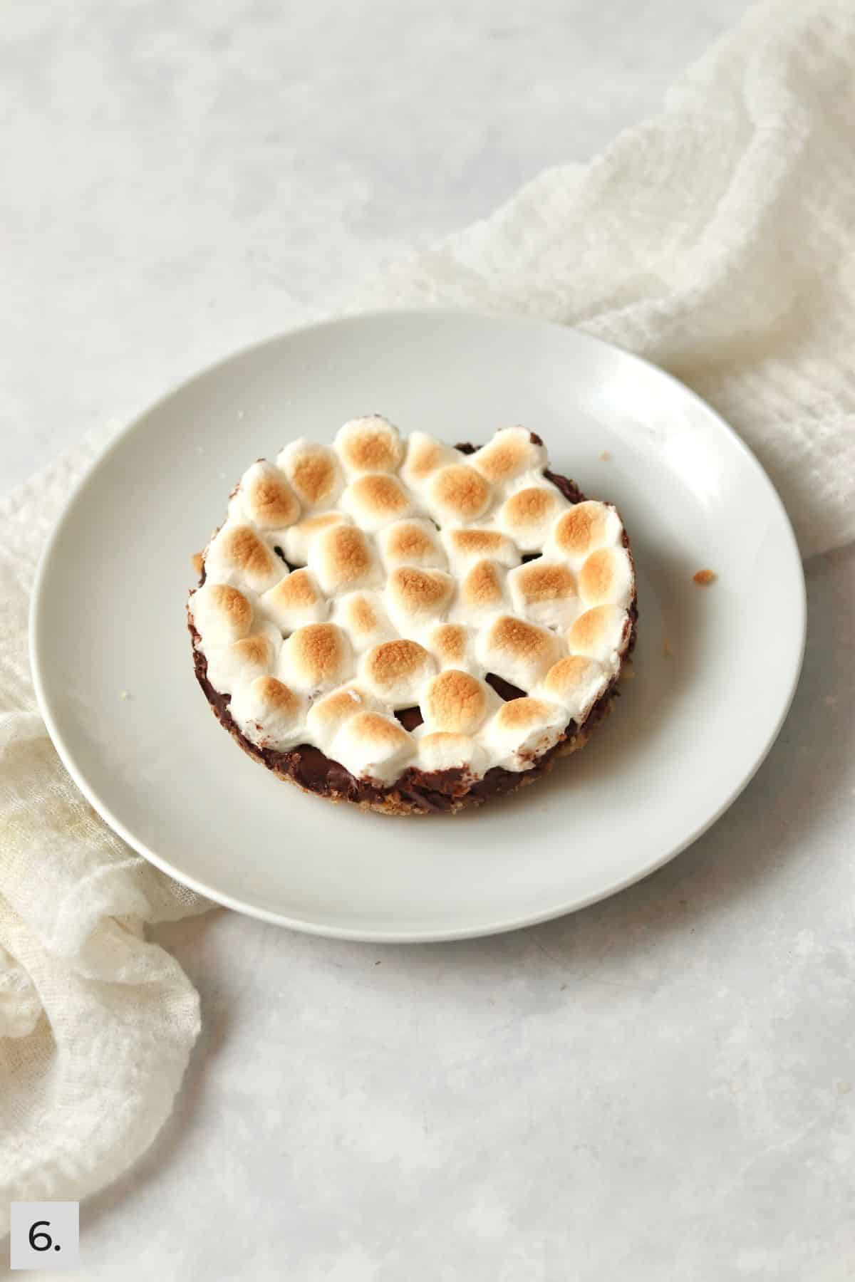 Single s'mores bar on a small plate.