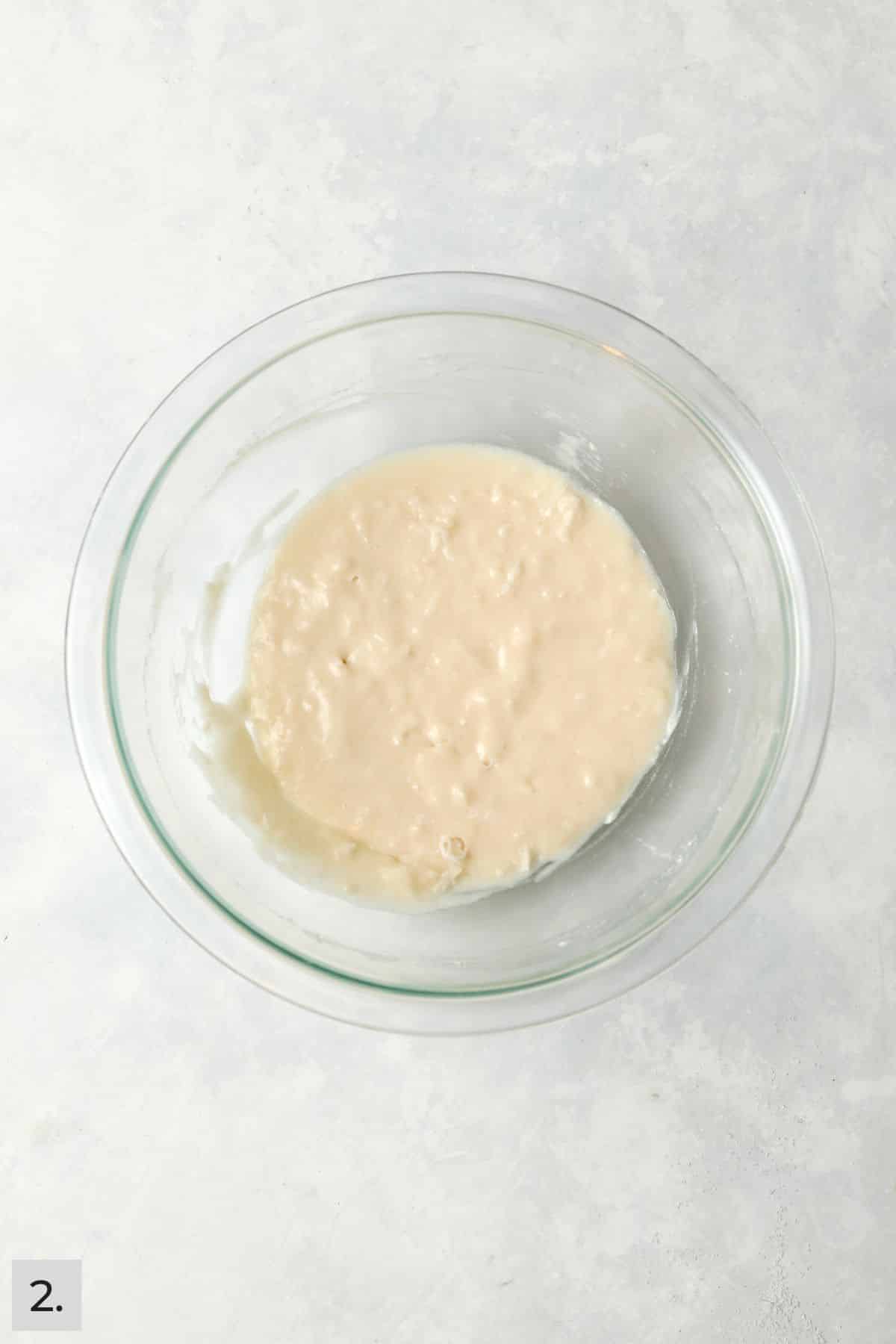Small batch of coconut cake batter in a mixing bowl.