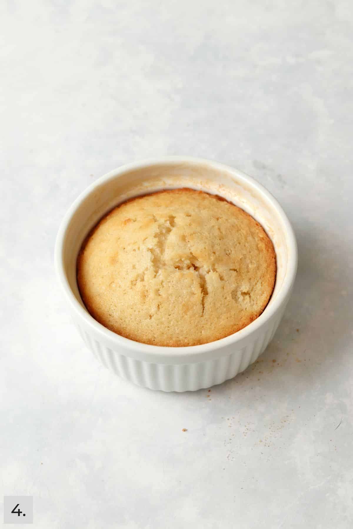 Baked single serve coconut cake in a ramekin.