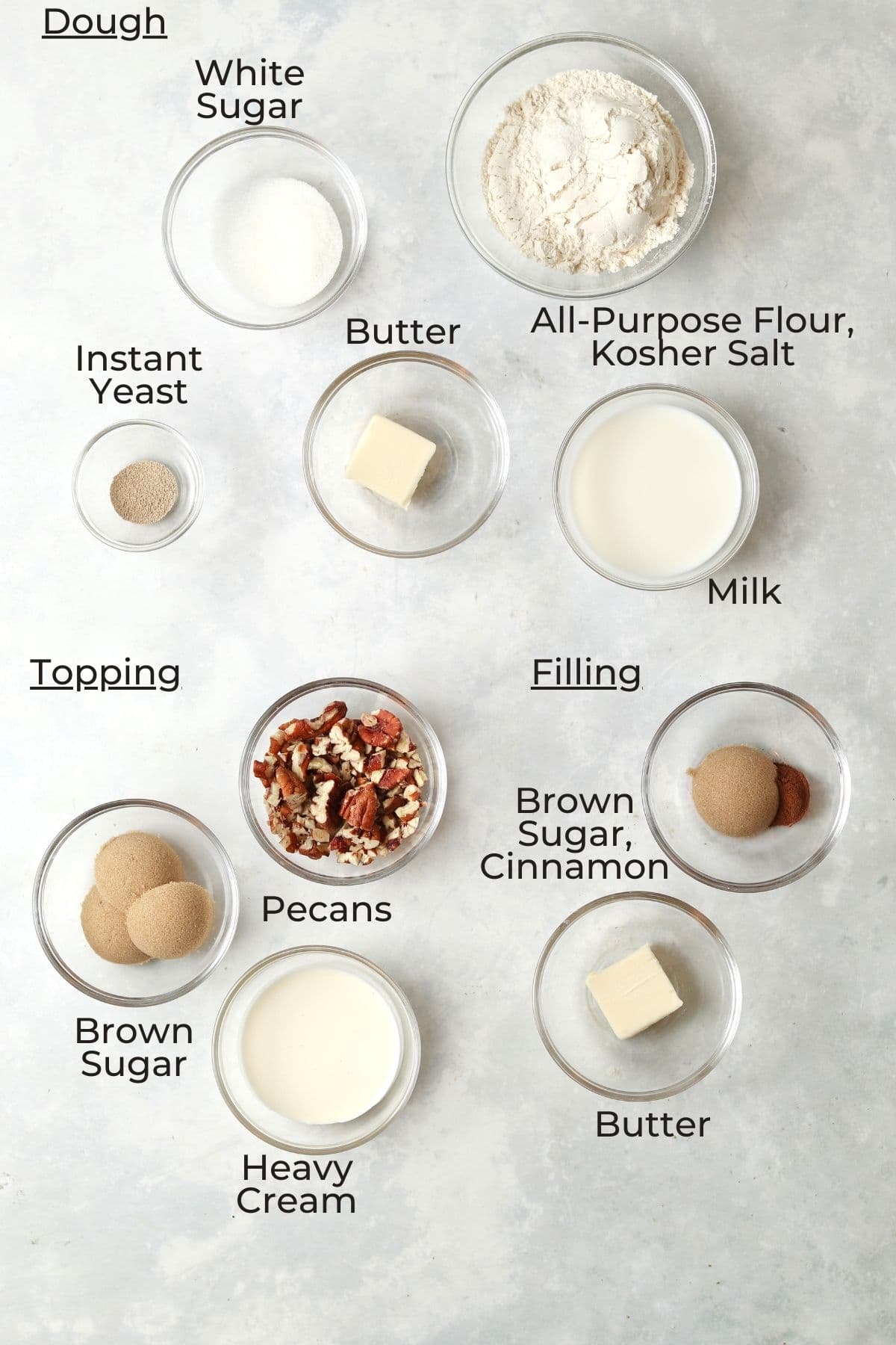 Ingredients for an individual pecan sticky bun in small glass prep bowls.
