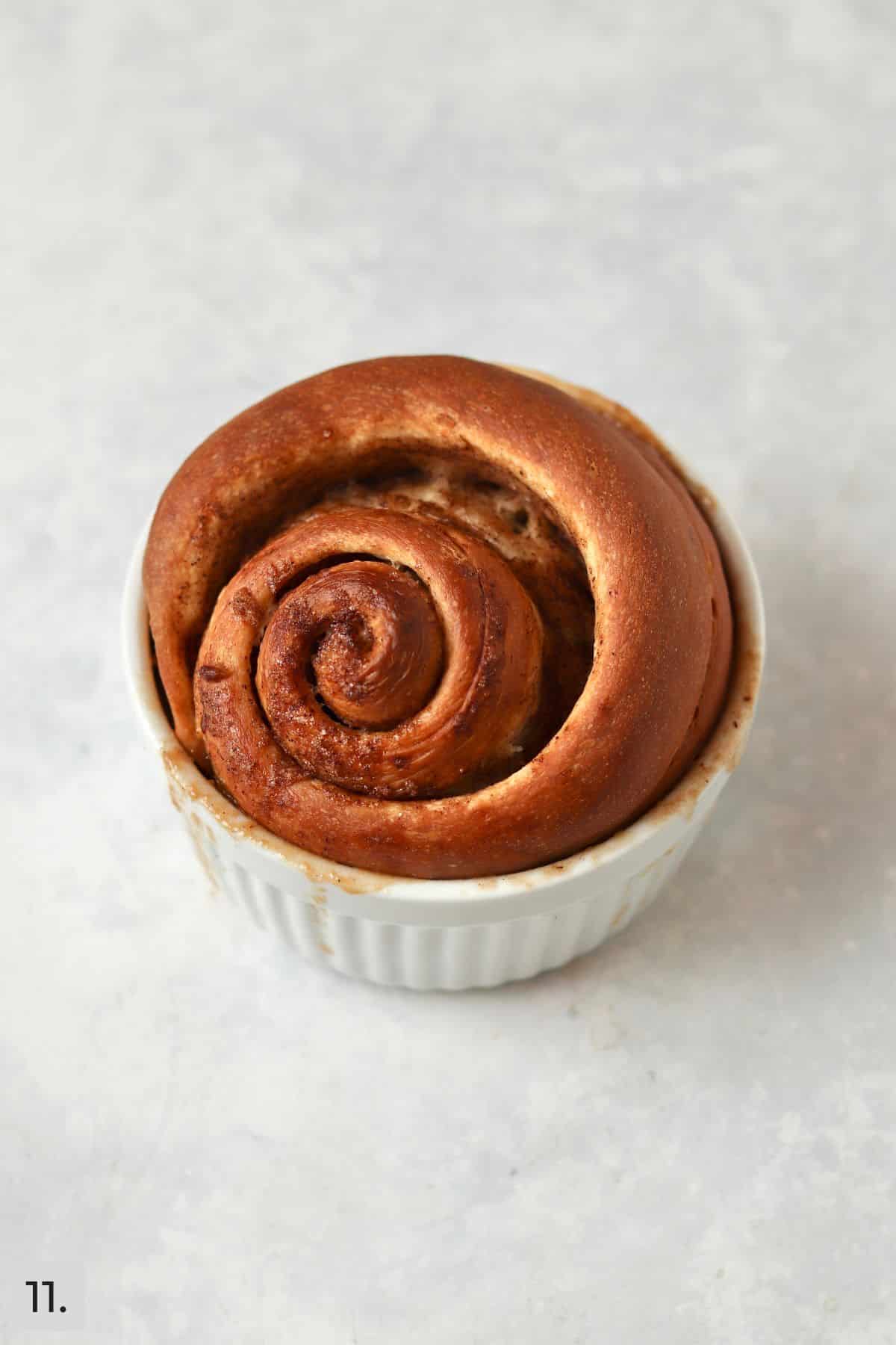 Baked pecan sticky bun in ramekin.