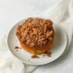 Single serve pumpkin coffee cake with streusel on a plate.