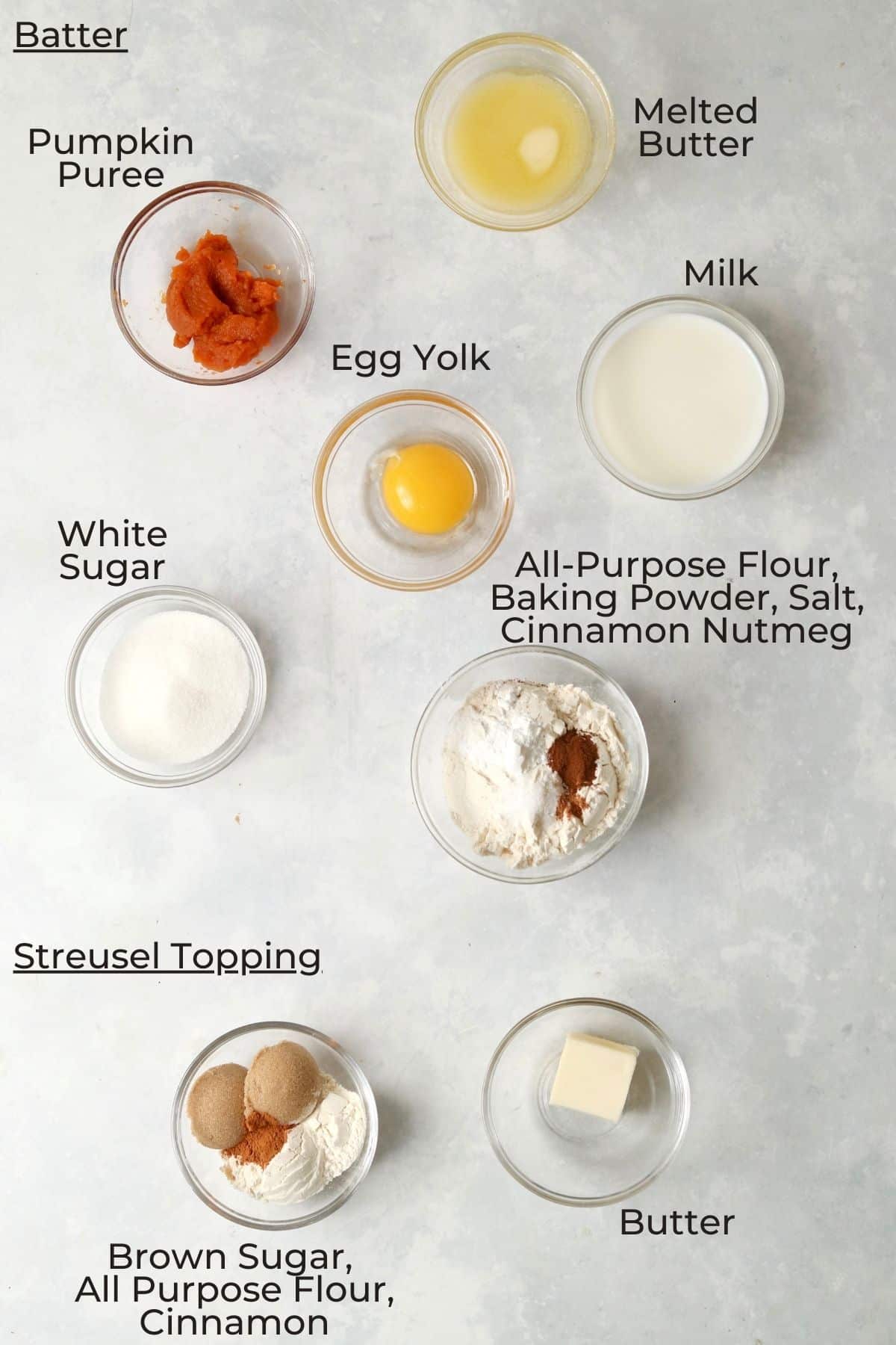 Ingredients to make a small pumpkin streusel coffee cake in glass prep bowls.