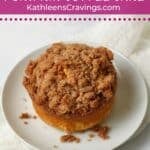 Individual Pumpkin Coffee Cake with streusel topping on a plate.