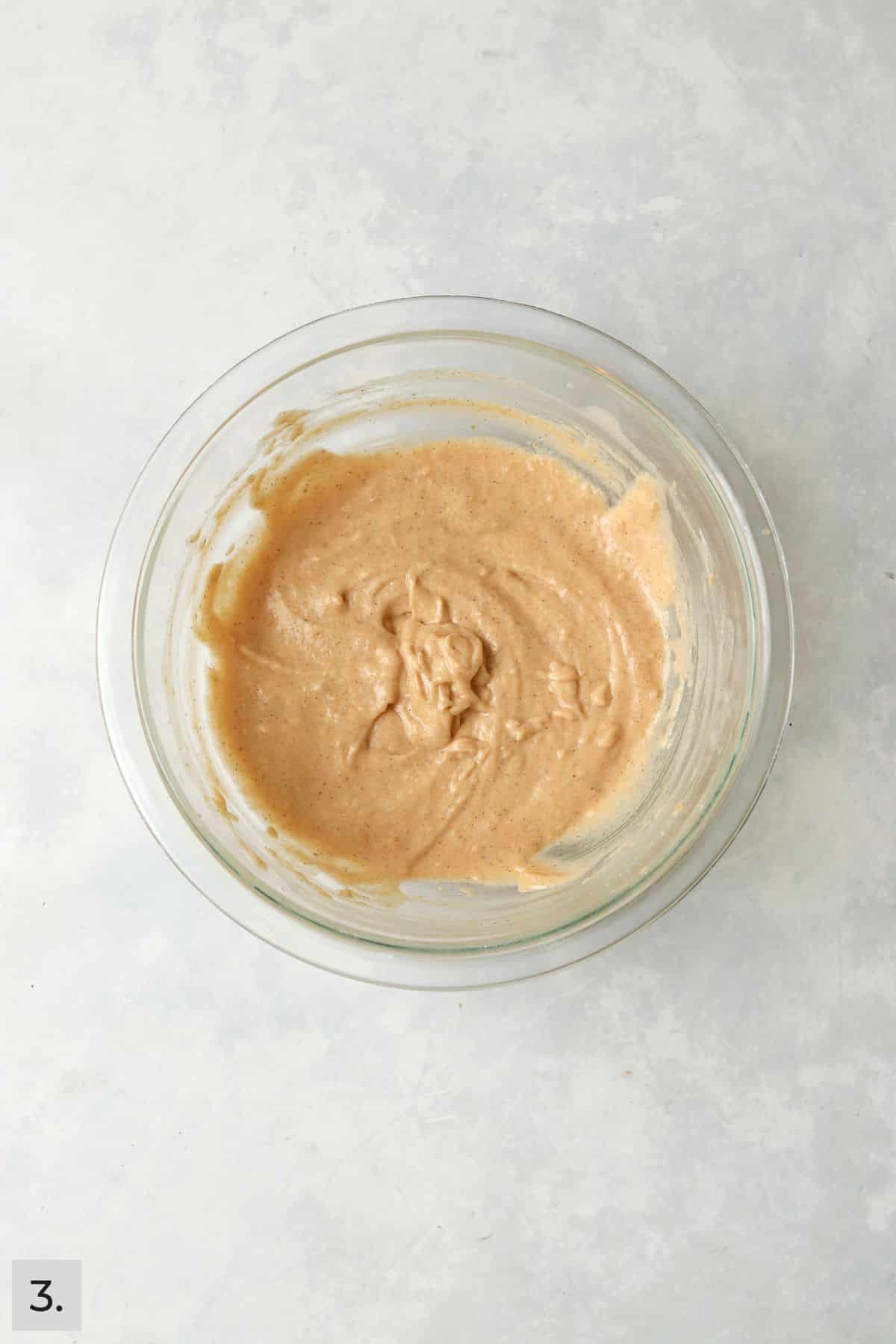 Pumpkin coffee cake batter in a mixing bowl.