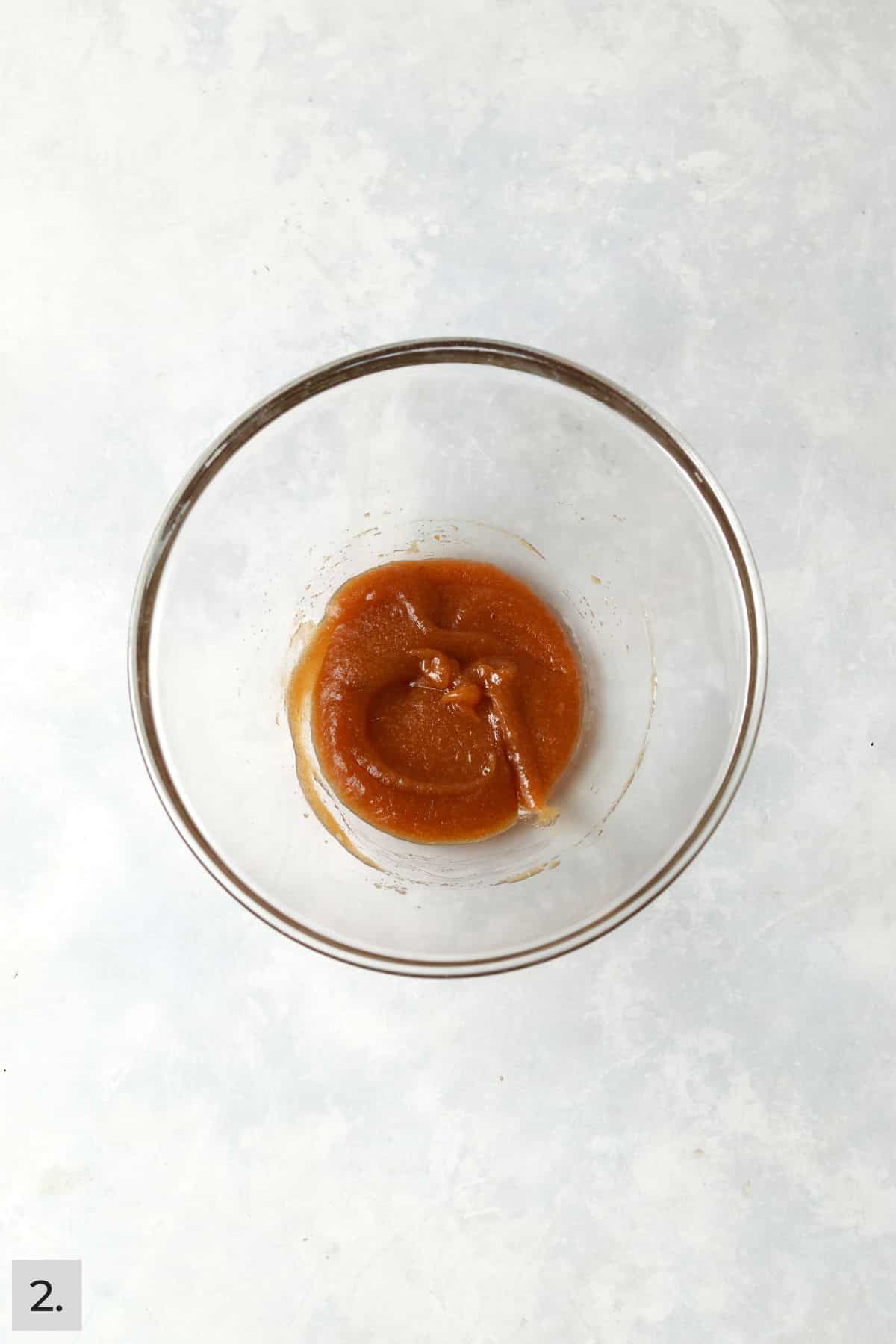 Pumpkin cookie wet ingredients mixed together in a bowl.