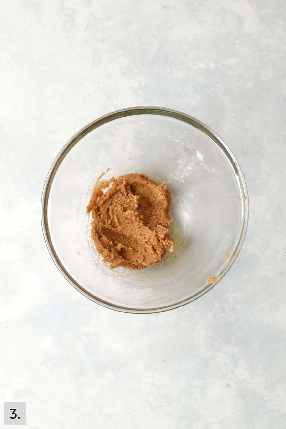 Small batch of pumpkin cookie dough in a bowl.