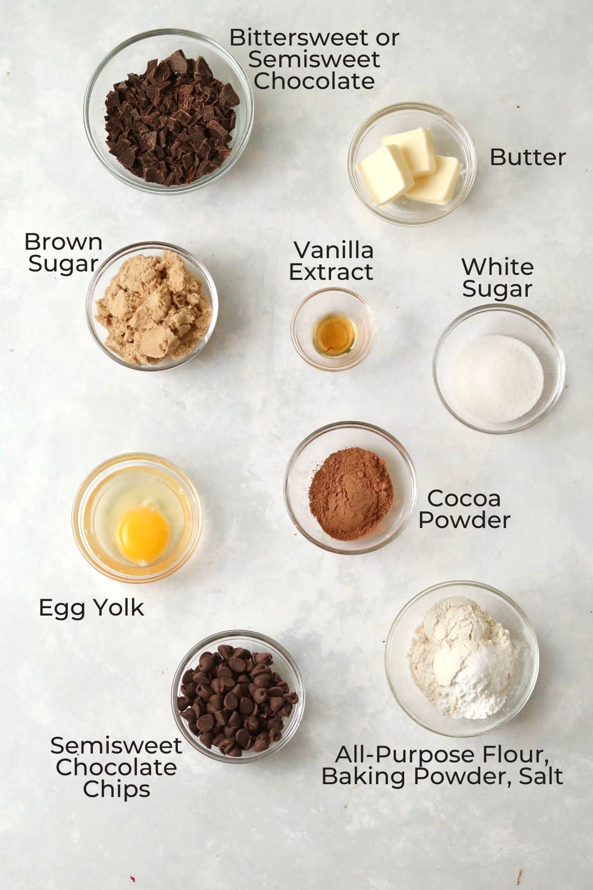 Ingredients to make brownie cookies in glass prep bowls.