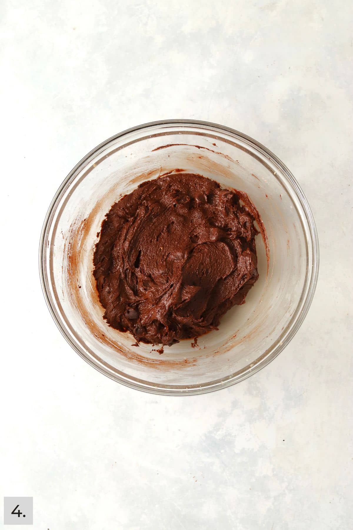 Brownie cookie dough in a glass bowl.