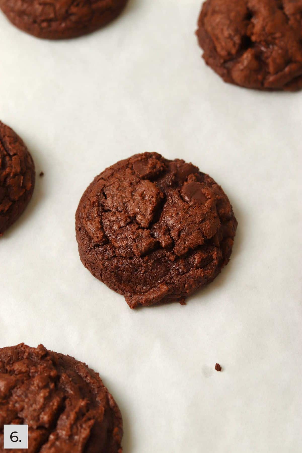 Baked brownie cookie on a baking sheet.