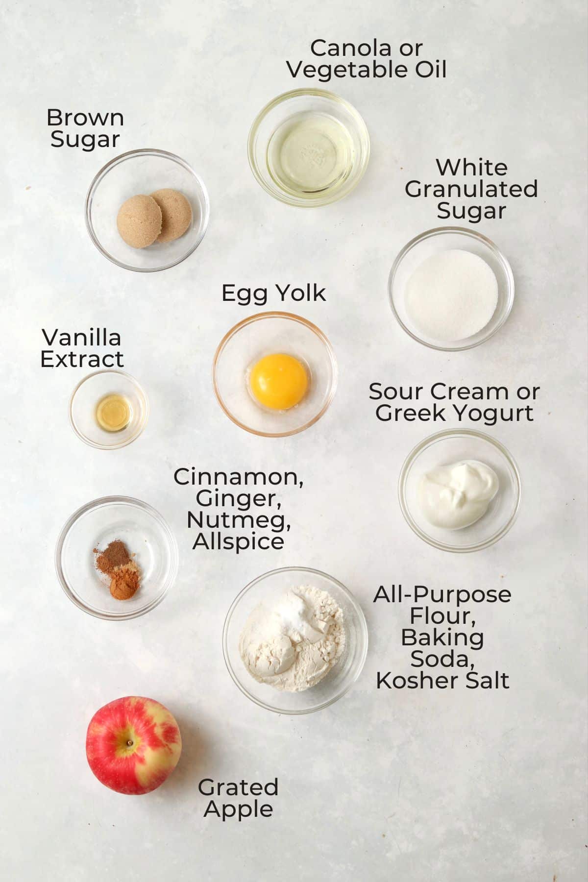 Ingredients to make a single serve apple cake in small glass bowls.