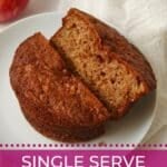Single serve apple cake with fresh apple cut in half on a plate.