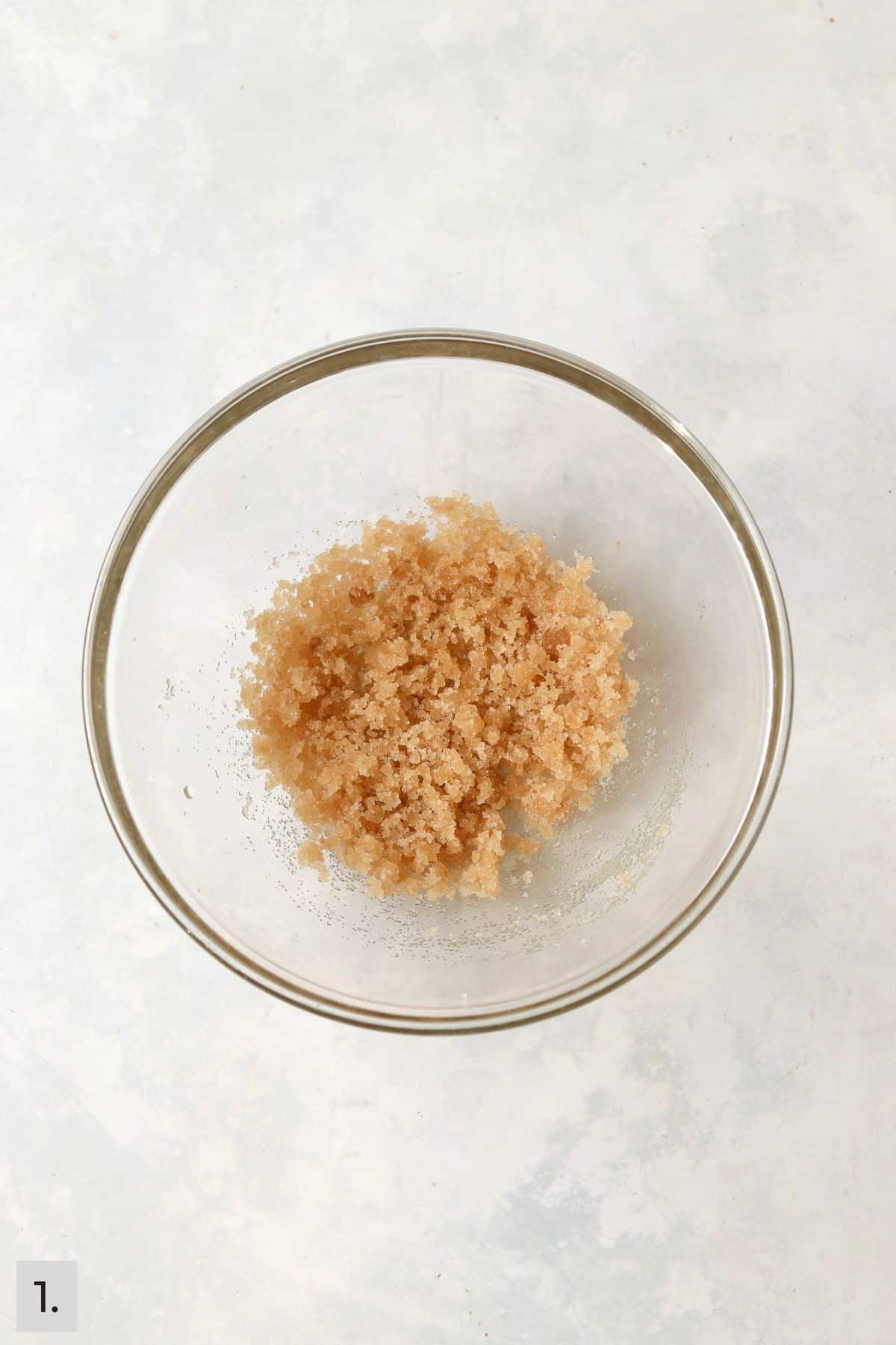 Oil mixed with sugar and brown sugar in a mixing bowl.