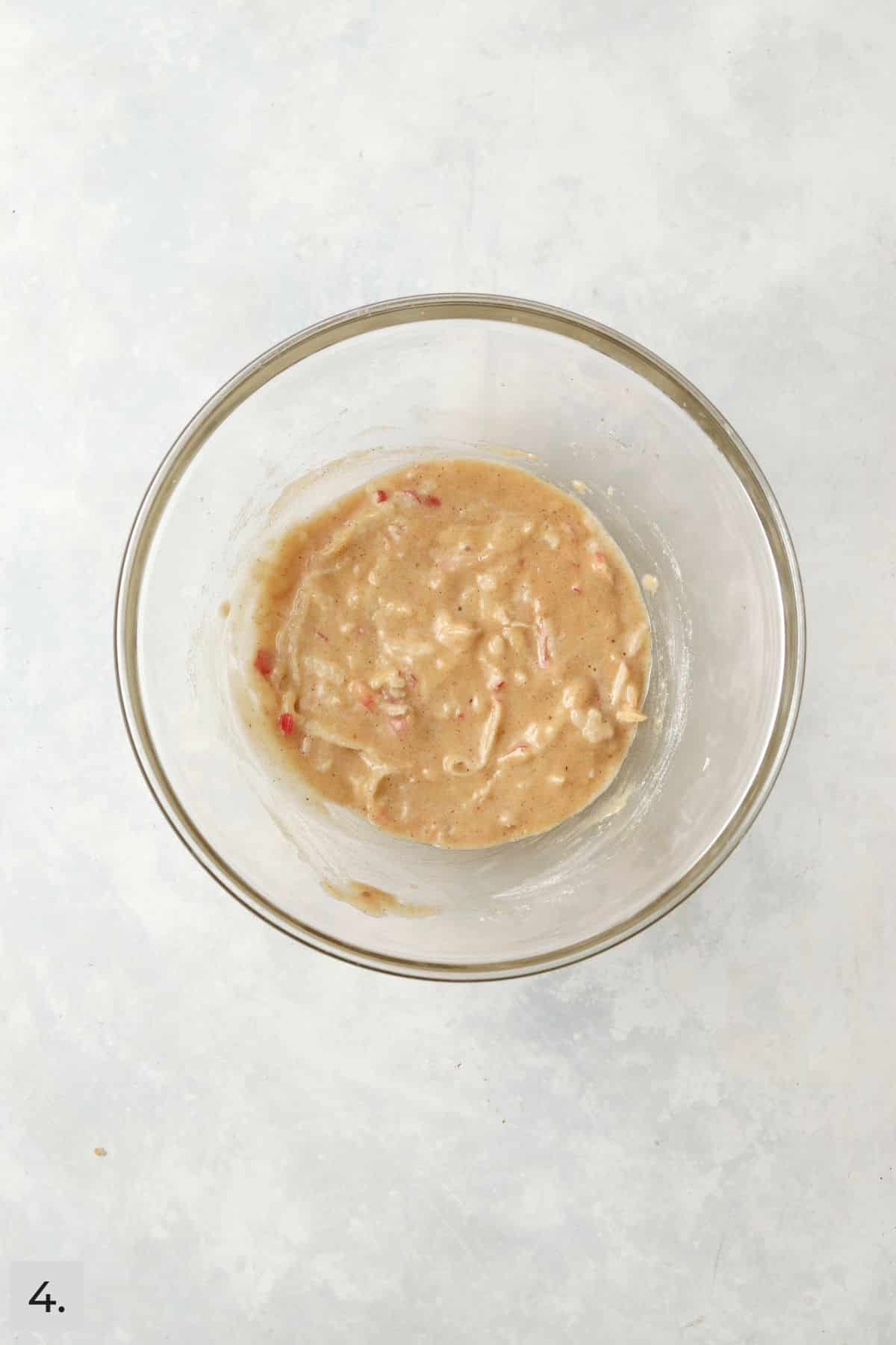 Single serve apple cake batter in a mixing bowl.