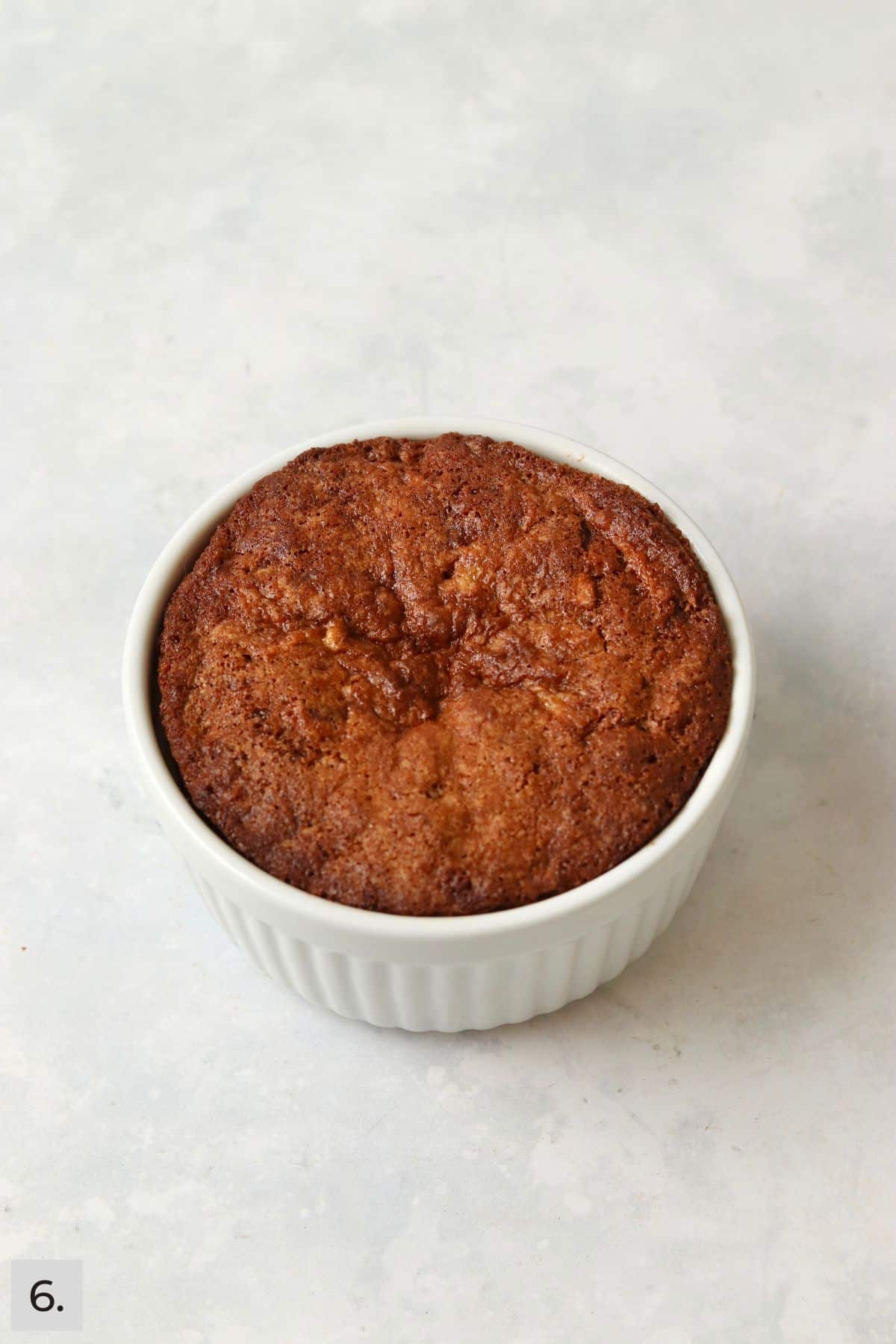 Baked single serve apple cake in a ramekin.