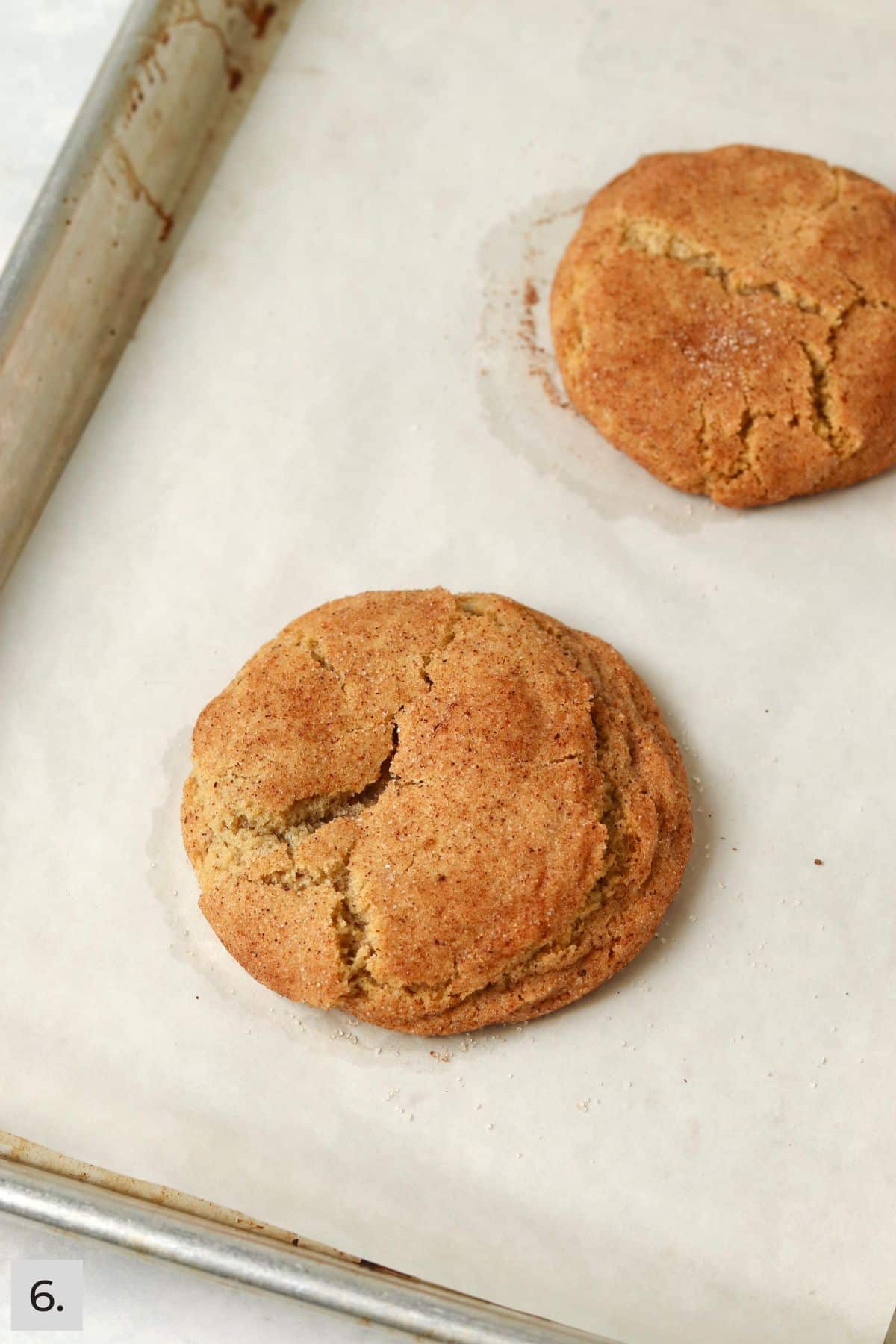 Baked chai spiced cookies on a baking sheet.
