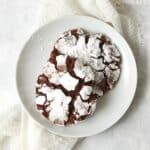 Single serve chocolate crinkle cookie on a small plate.