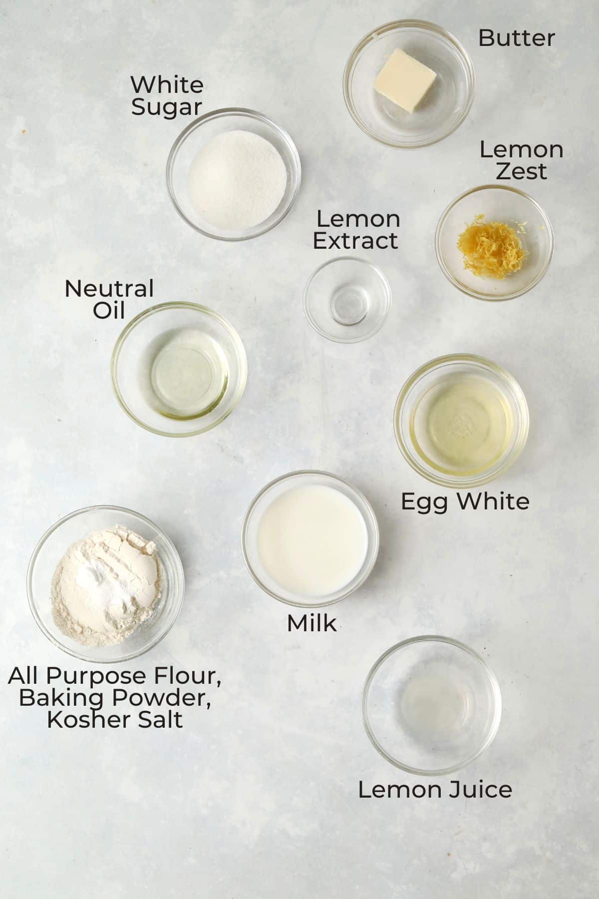 Single serve lemon cake ingredients in small glass prep bowls.