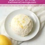 Single serve lemon cake with cream cheese frosting on a plate.
