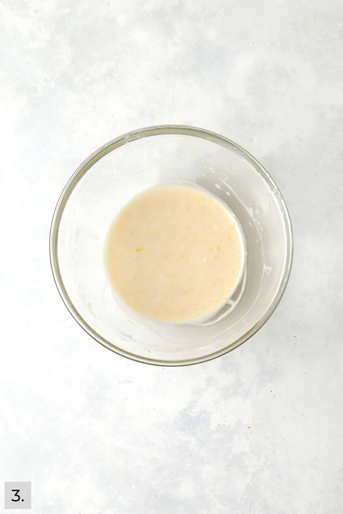 Small batch of lemon cake batter in a mixing bowl.