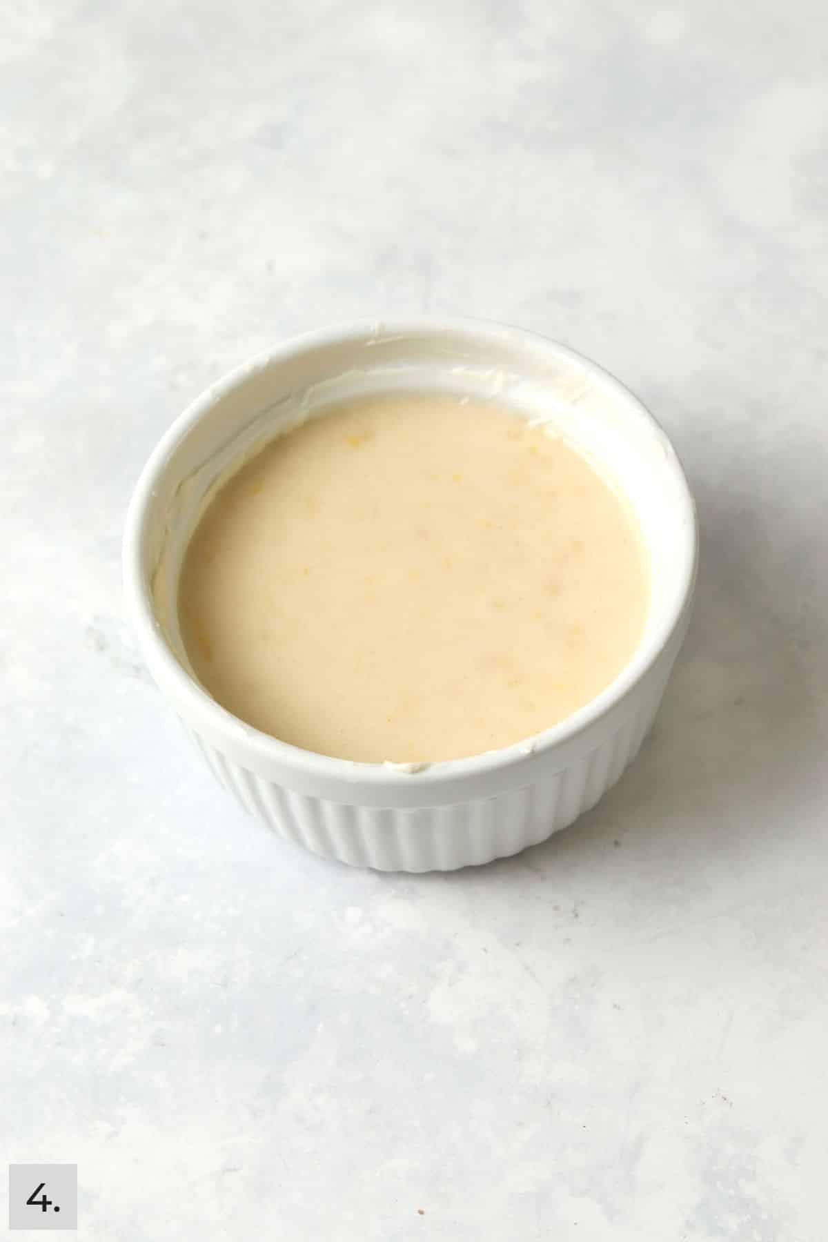 Unbaked single serve lemon cake in a ramekin.