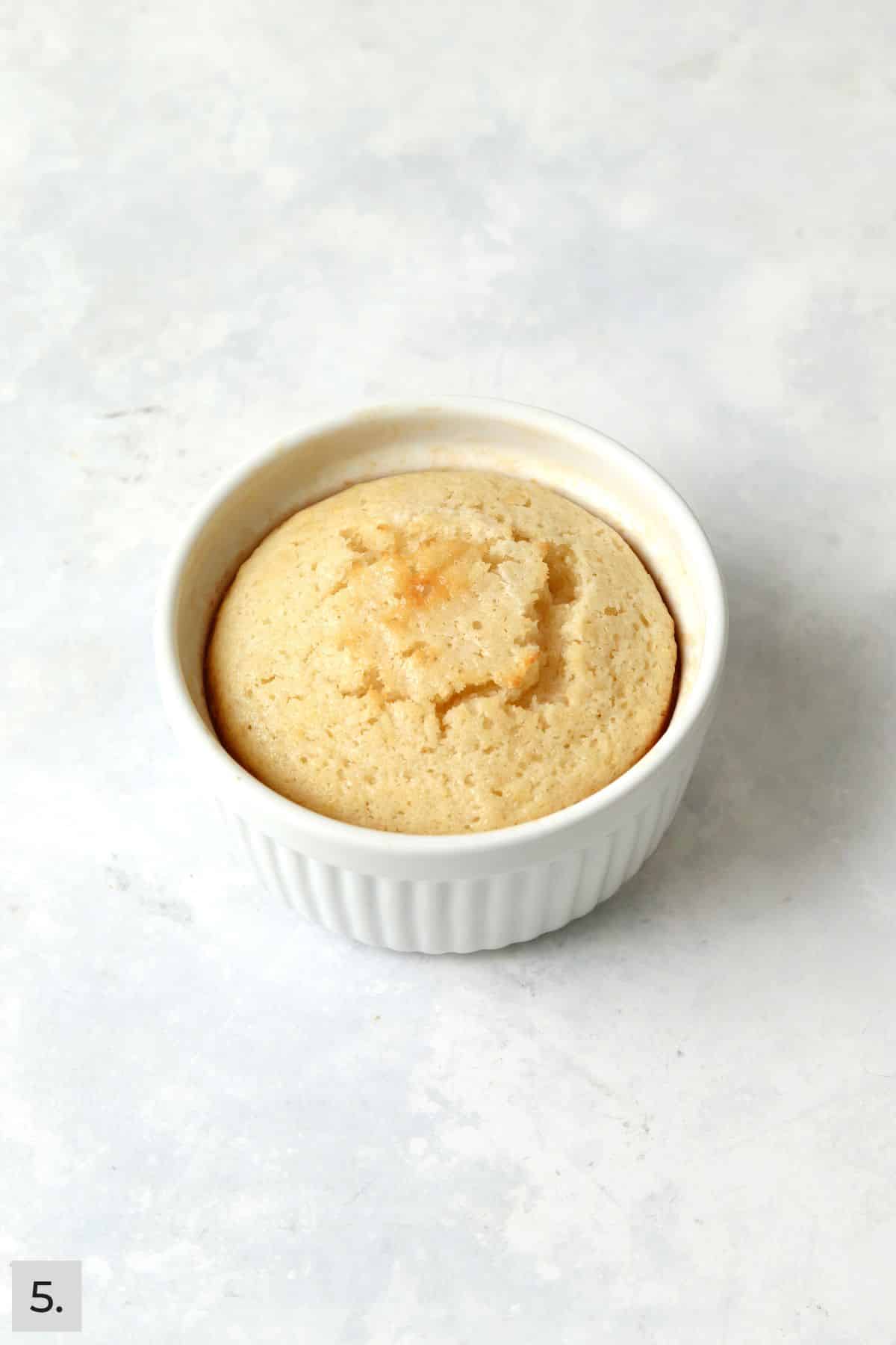 Baked single serve lemon cake in a ramekin.